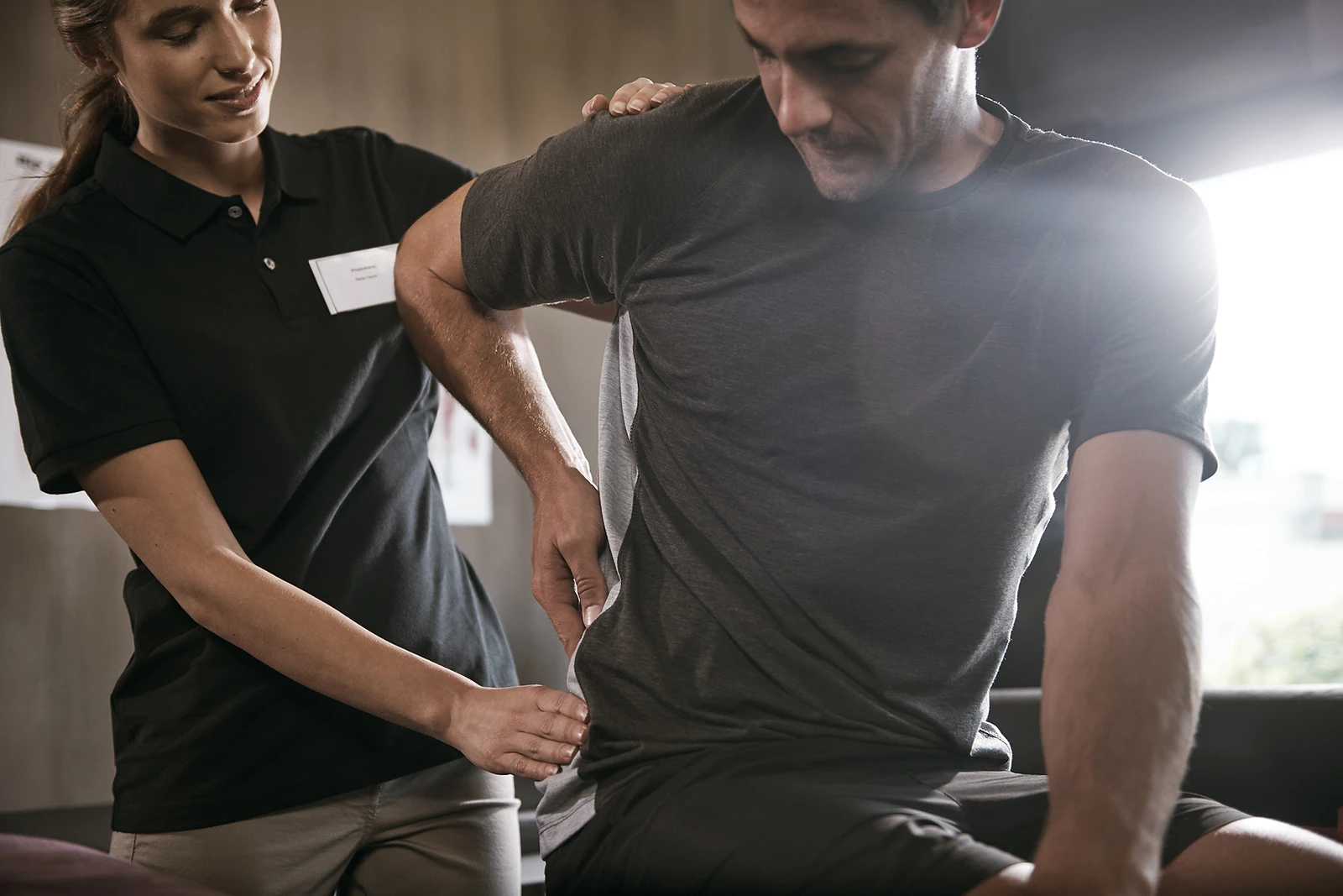 Chiropractor Helping Patient